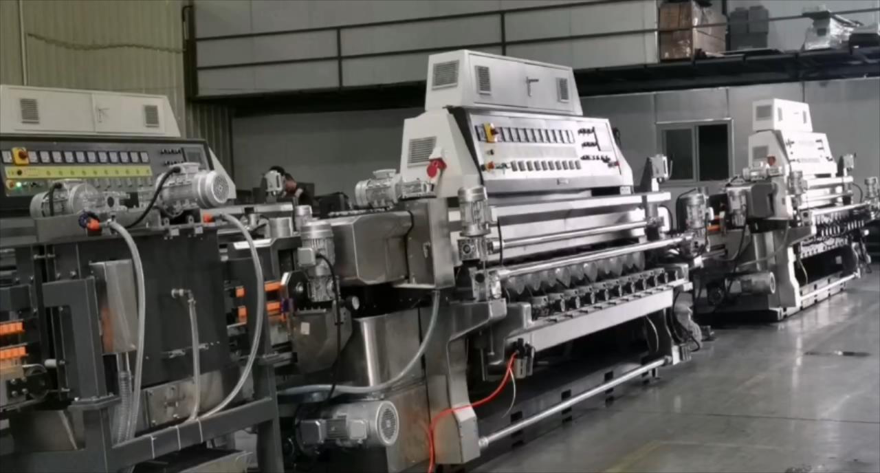 Automotive rearview mirror glass edge grinding machine